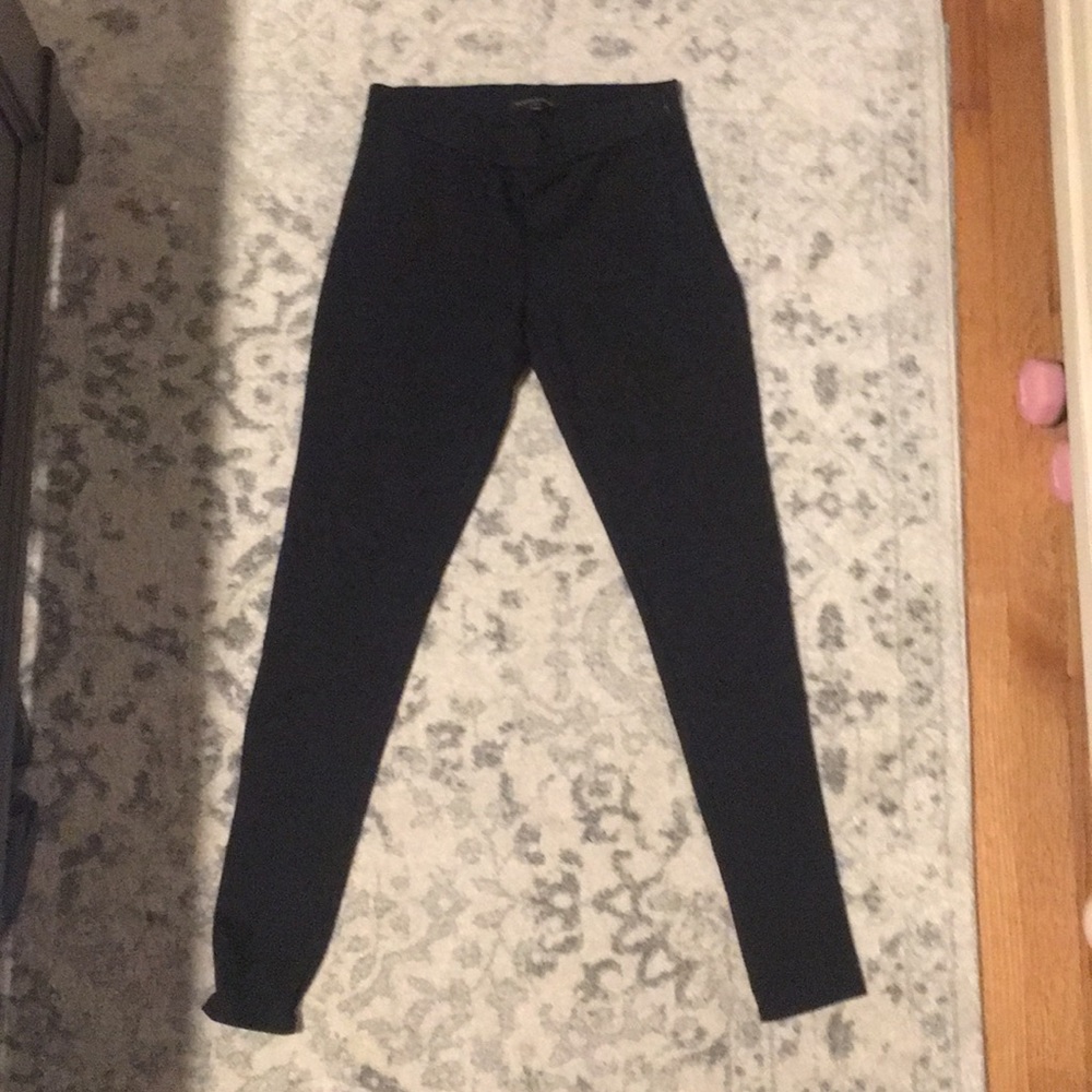 Black legging with motto detailing on the knee